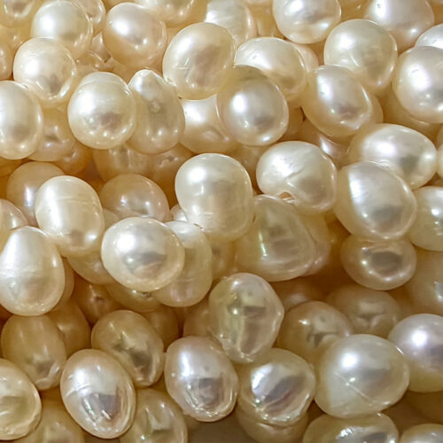 white 6x7mm peanut pearl strands with large holes